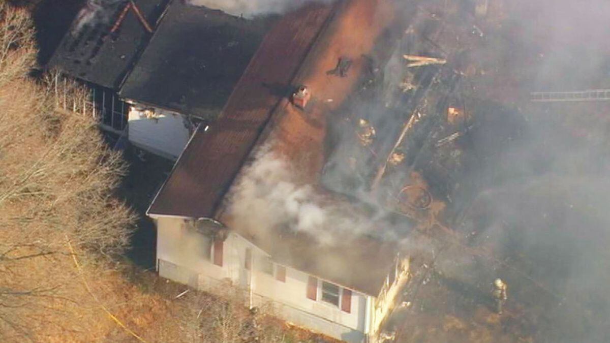 Firefighters battle heavy smoke, flames at Gastonia home